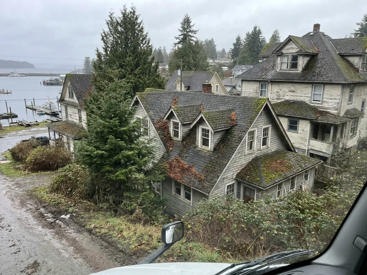 Heritage timber houses with steep gables and dormers in the old Chemainus townsite near the water